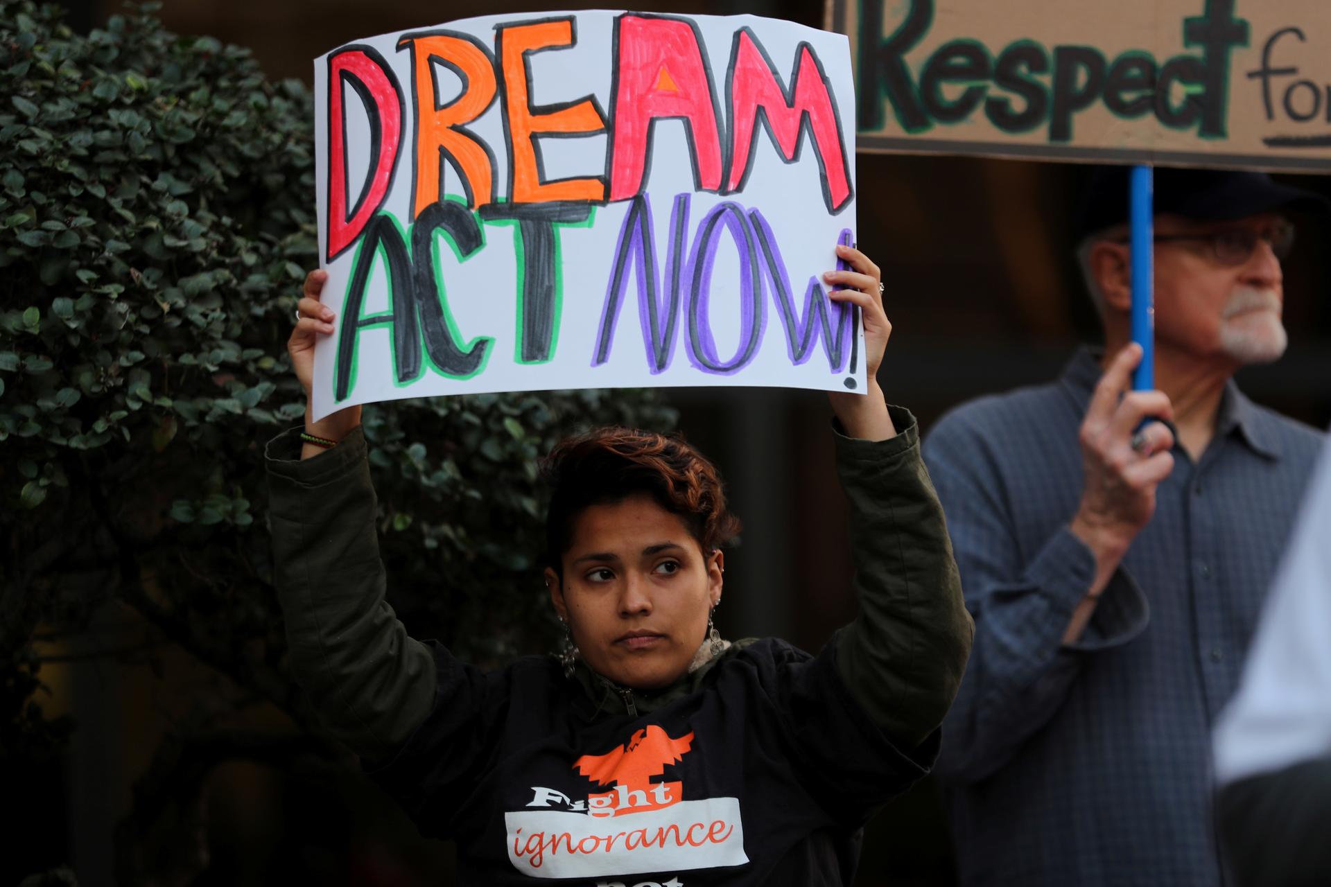 A women demanding action by the federal government on the Deferred Action for Childhood Arrivals (DACA) protests with a group in downtown San Diego. 
