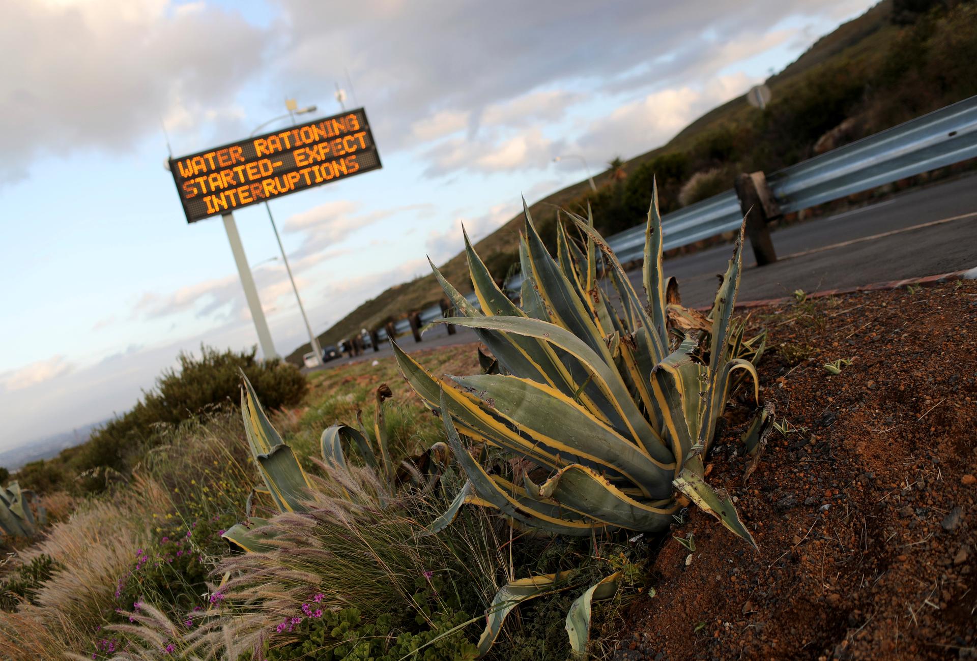 Sign warning residents of water restrictions is seen in Cape Town. 