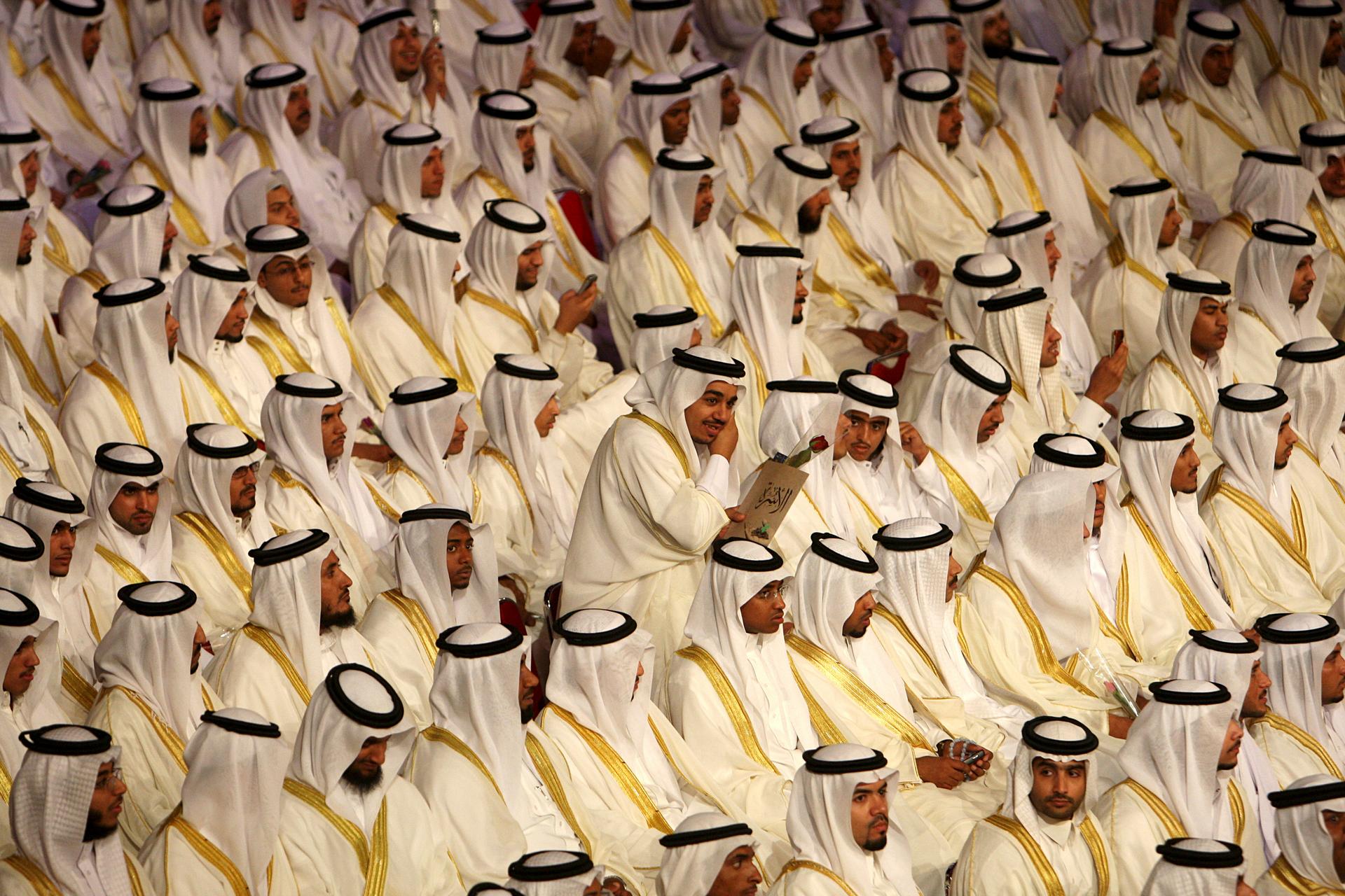 Saudi men gather in anticipation of a group wedding aided by the government