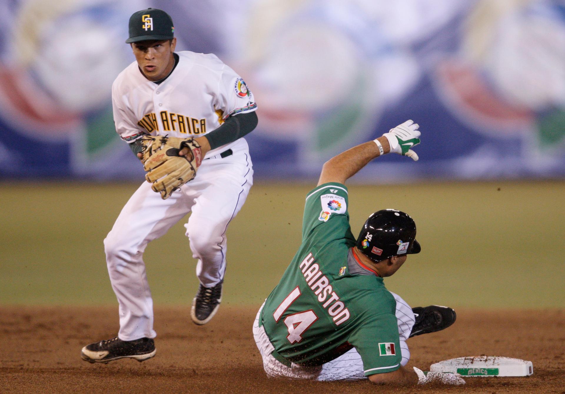 Mexico's Scott Hairston (14) is out at second base as South Africa's Anthony Phillips throws to first base during the first inning of their World Baseball Classic game in Mexico City March 9, 2009.
