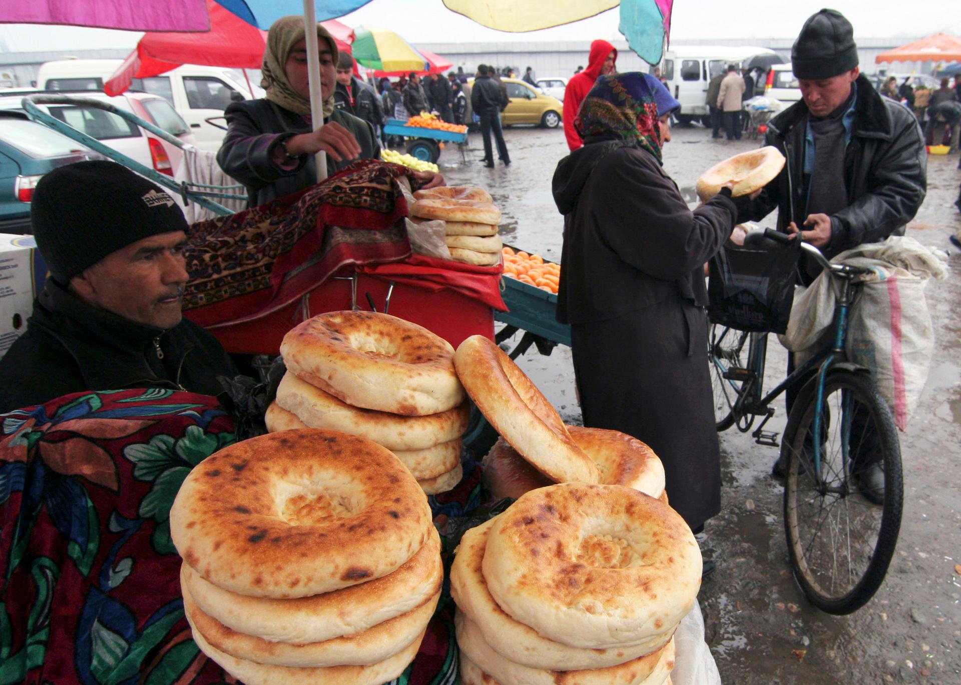A man sells flat cakes in Dushanbe February 23, 2009.