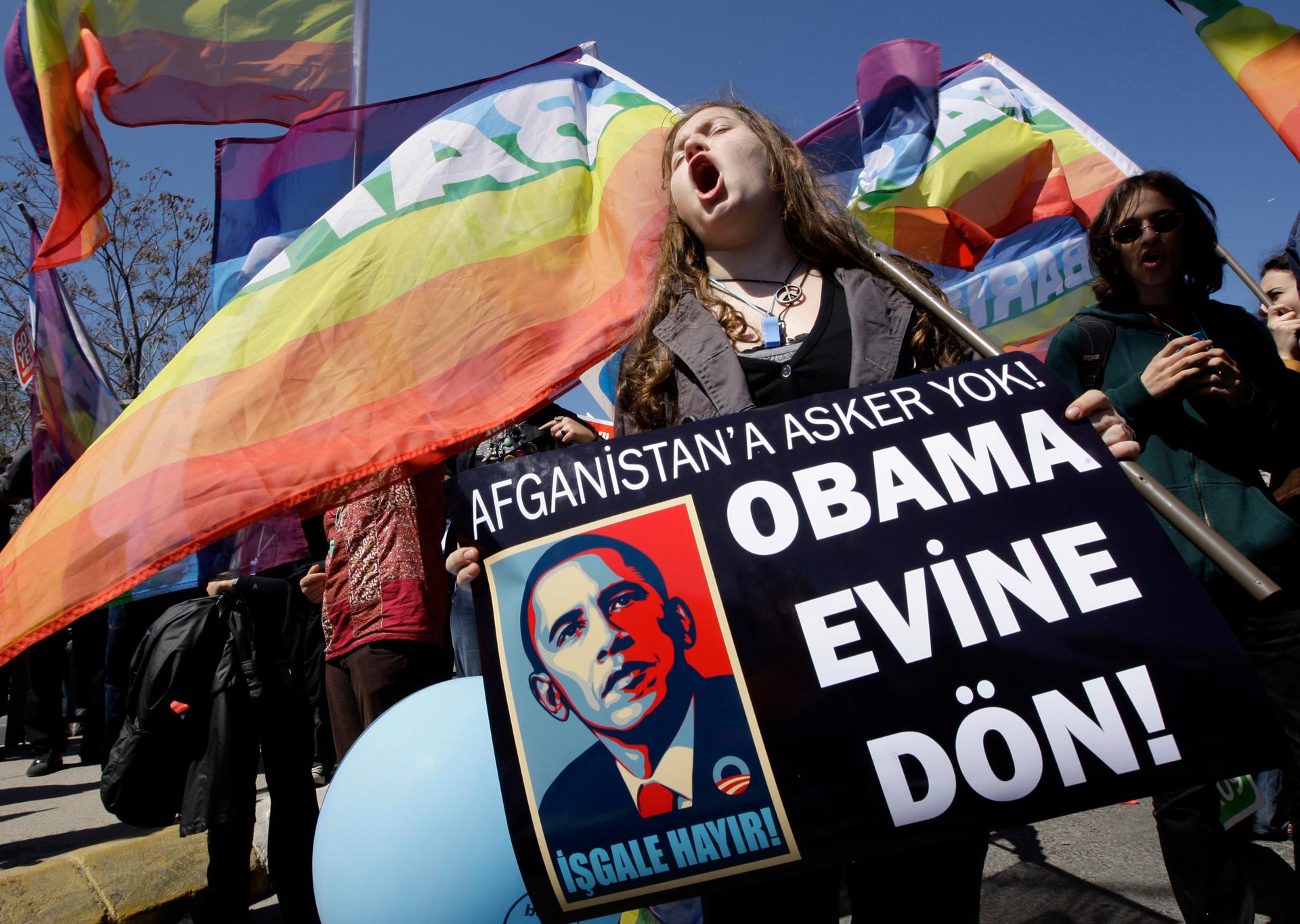 A Turkish demonstrator holds a banner in Istanbul in April 2009. It reads, "No soldiers for Afghanistan. Return to your home Obama." 