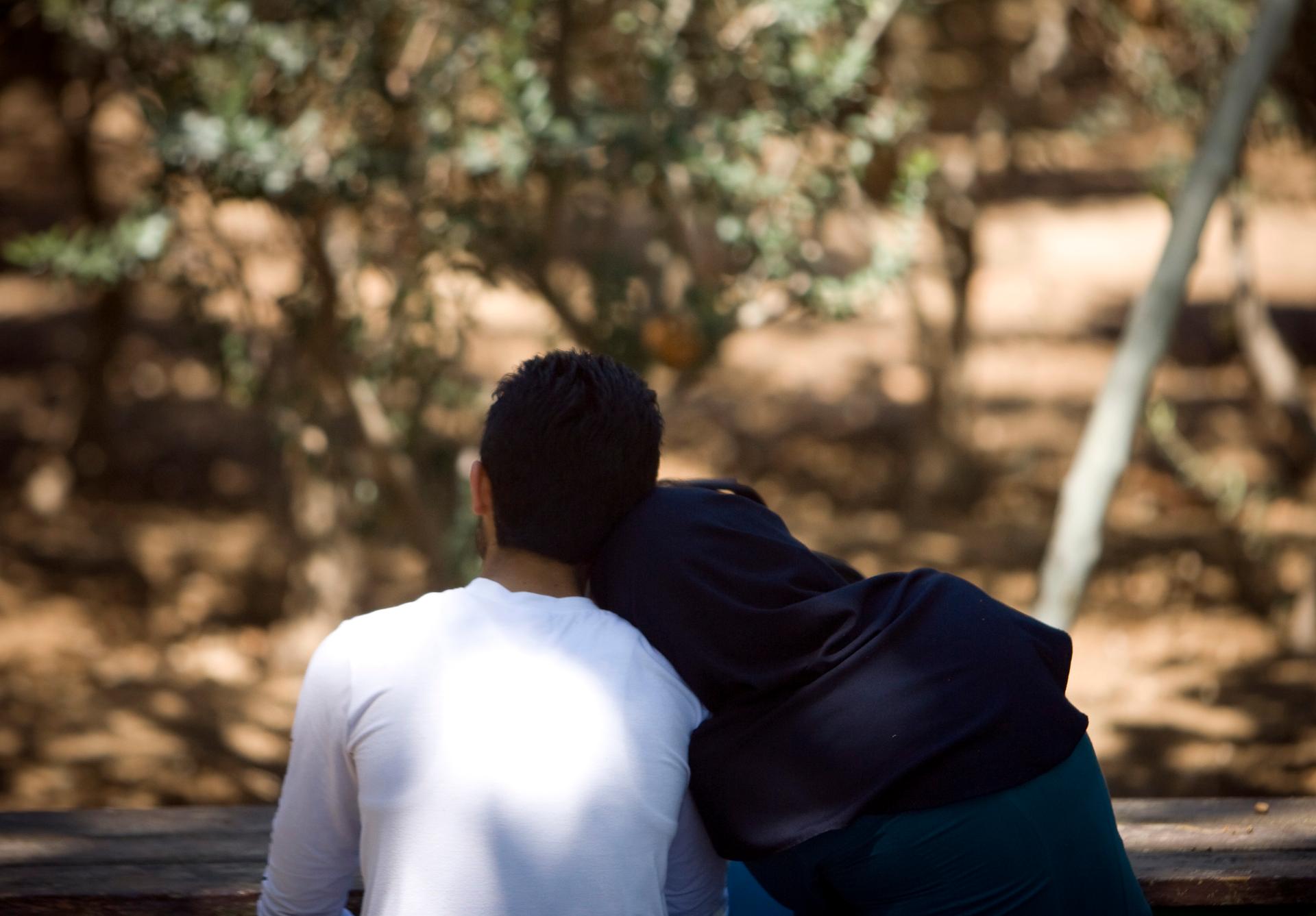 An Iranian couple rests in a park in central Tehran.