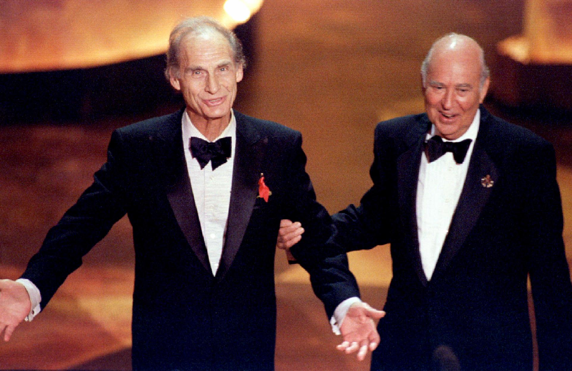 Television comedy legends Sid Caesar (L) and Carl Reiner are greeted by the audience September 10 at the 47th Annual Emmy Award s held in Pasadena
