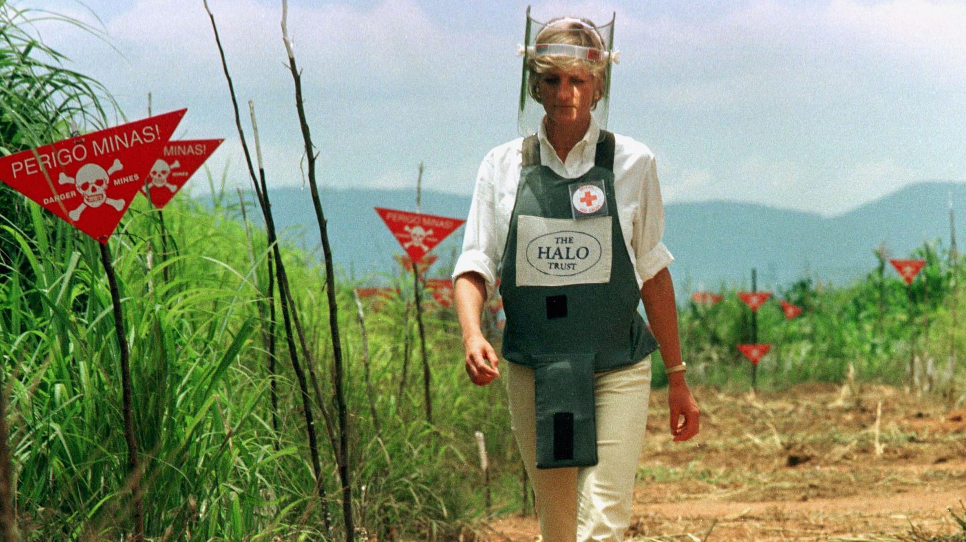 Princess Diana walks through a minefield in Angola, 1997