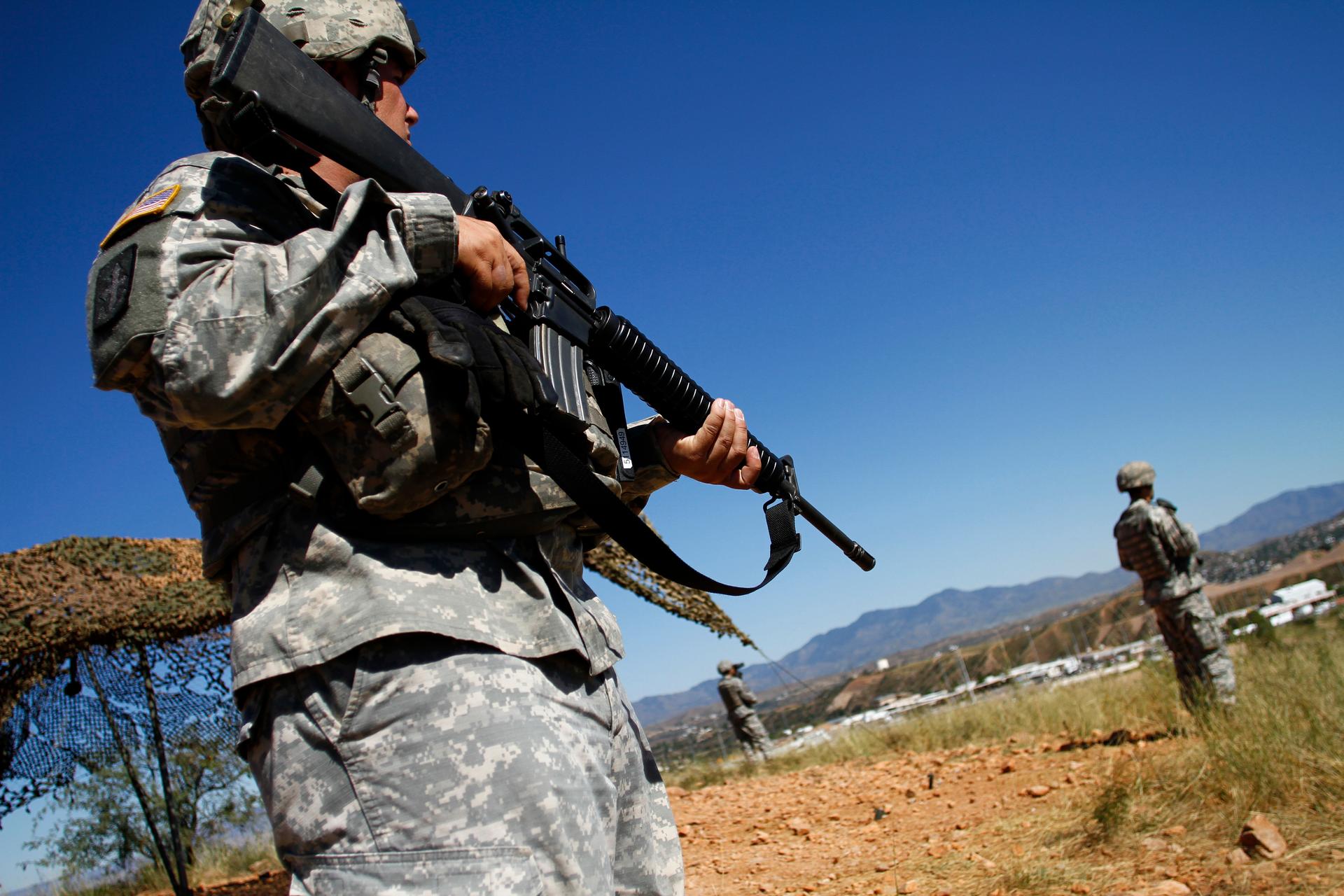 National Guard troops patrol along the US-Mexico border in Nogales, Arizona, in 2010. Texas is authorizing a similar call-up on its border.