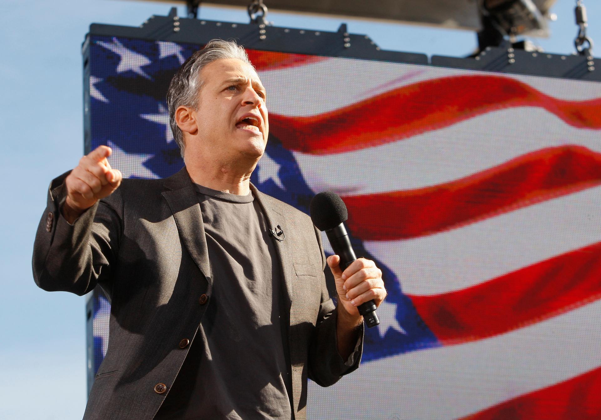 Comedian Jon Stewart addresses the crowd during the "Rally to Restore Sanity and/or Fear" in Washington, October 30, 2010.