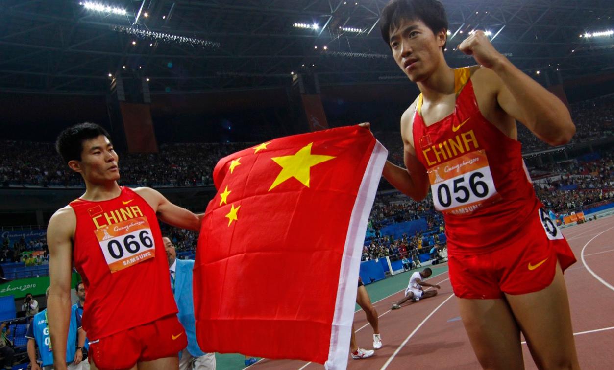 Chinese hurdler Shi Dongpeng, seen on the left after a race in the 2010 Asian Games in China, recenty reported being robbed in Rio.