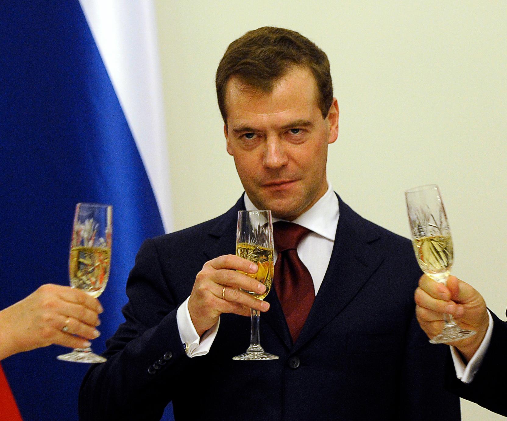 Then-President Dmitry Medvedev of Russia toasts with champagne during a state dinner in Warsaw in 2010.