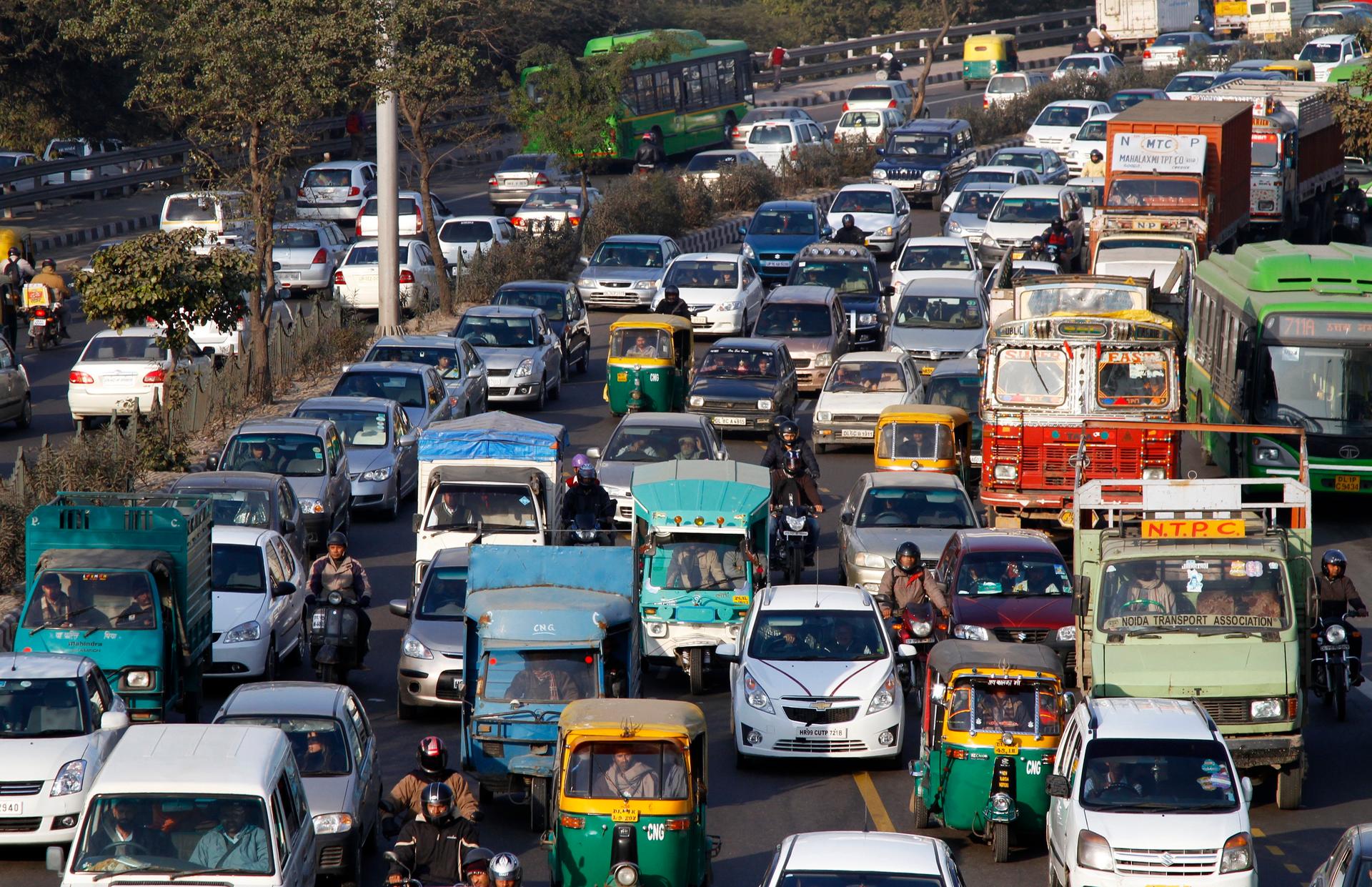 Heavy traffic along a busy road in New Delhi