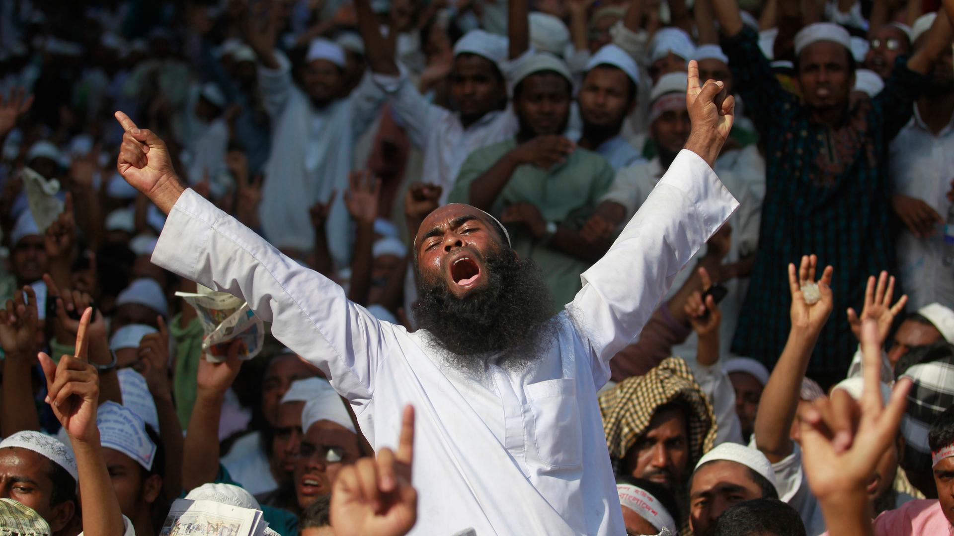 Activists from Hefajat-e-Islam, a Bangladeshi fundamentalist Muslim group that calls for the executions of atheist bloggers in the country, shout slogans during a 2013 rally.