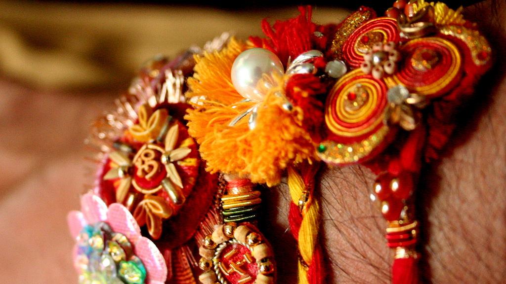 Rakhia are "sacred threads" that sisters tie onto their brothers' wrists for the Hindu festival of Raksha Bandhan.