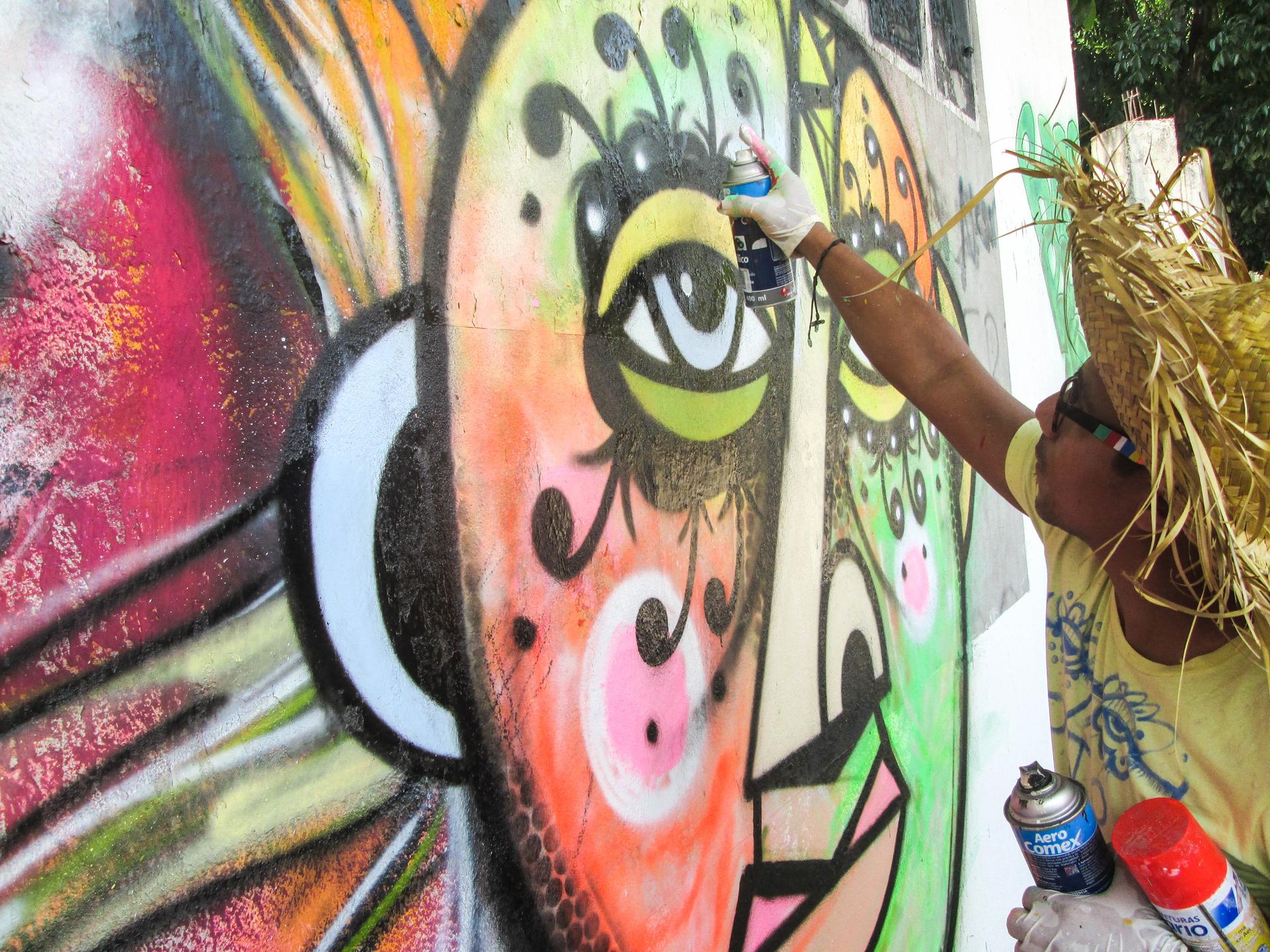 Graffiti artist Rei Blinky at work in San Pedro Sula, Honduras.
