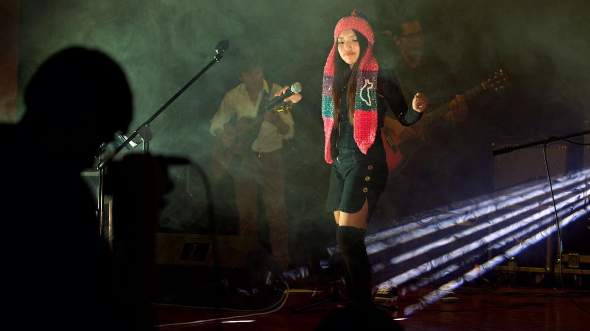 Fourteen-year-old Renata Flores at her first concert held in September 2015, in Ayacucho, Peru. The majority of popular cover songs she sang that night were in Quechua.