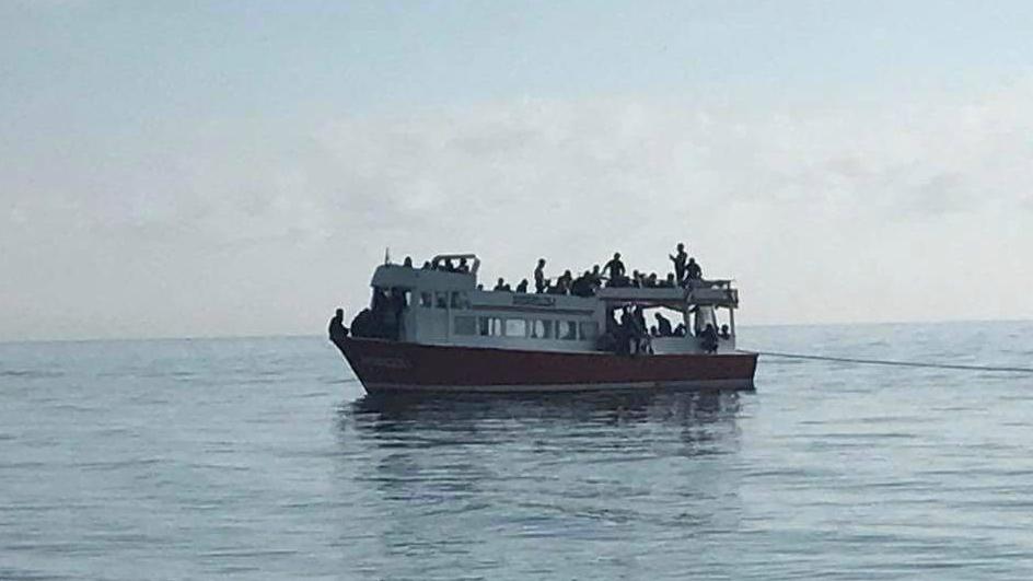 A migrant ship on the Black Sea is rescued by the Romanian coast guard.