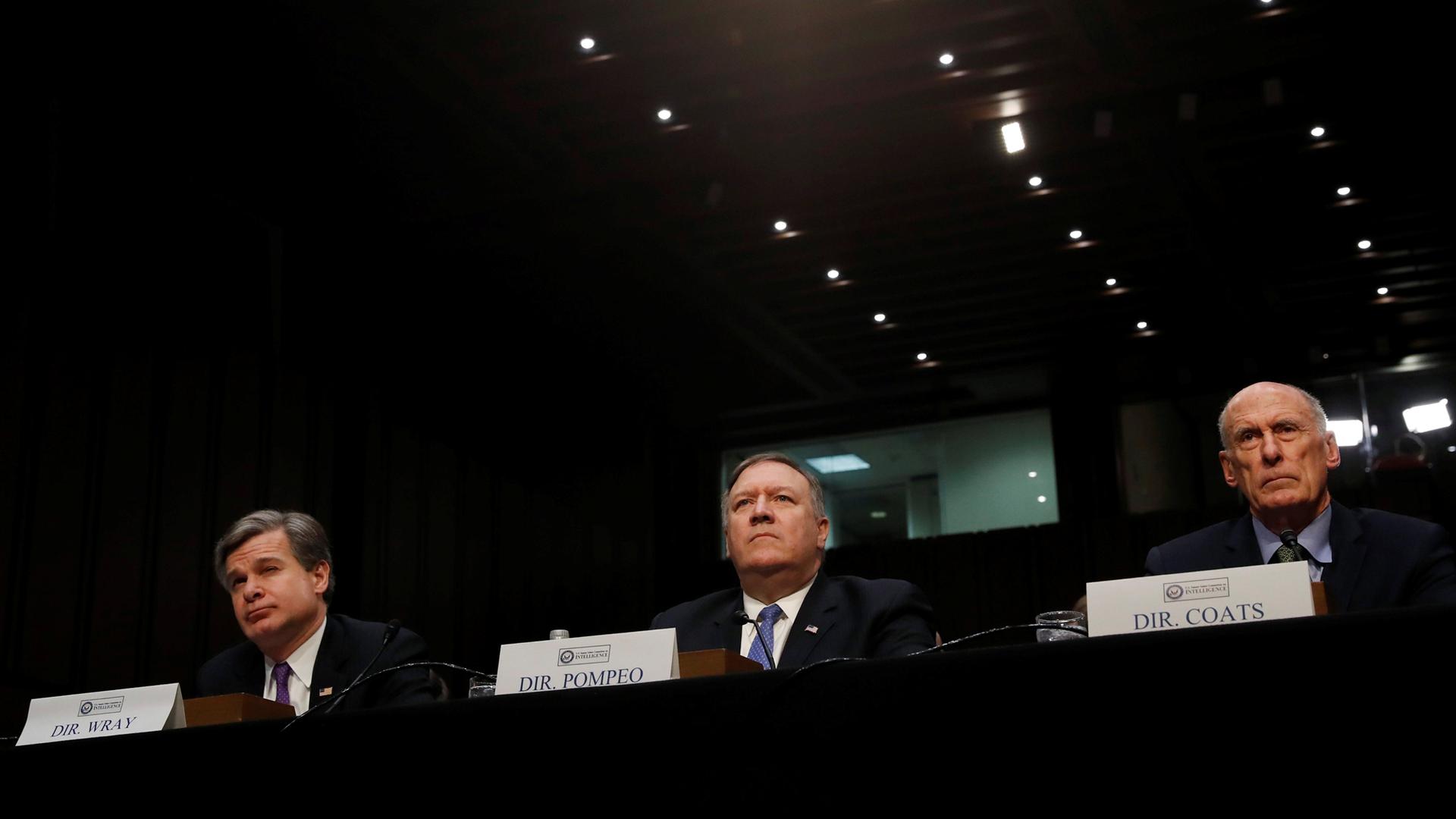 FBI Director Christopher Wray, CIA Director Mike Pompeo and Director of National Intelligence Dan Coats testify before a Senate Intelligence Committee hearing on "World Wide Threats" in Washington, Feb. 13, 2018.
