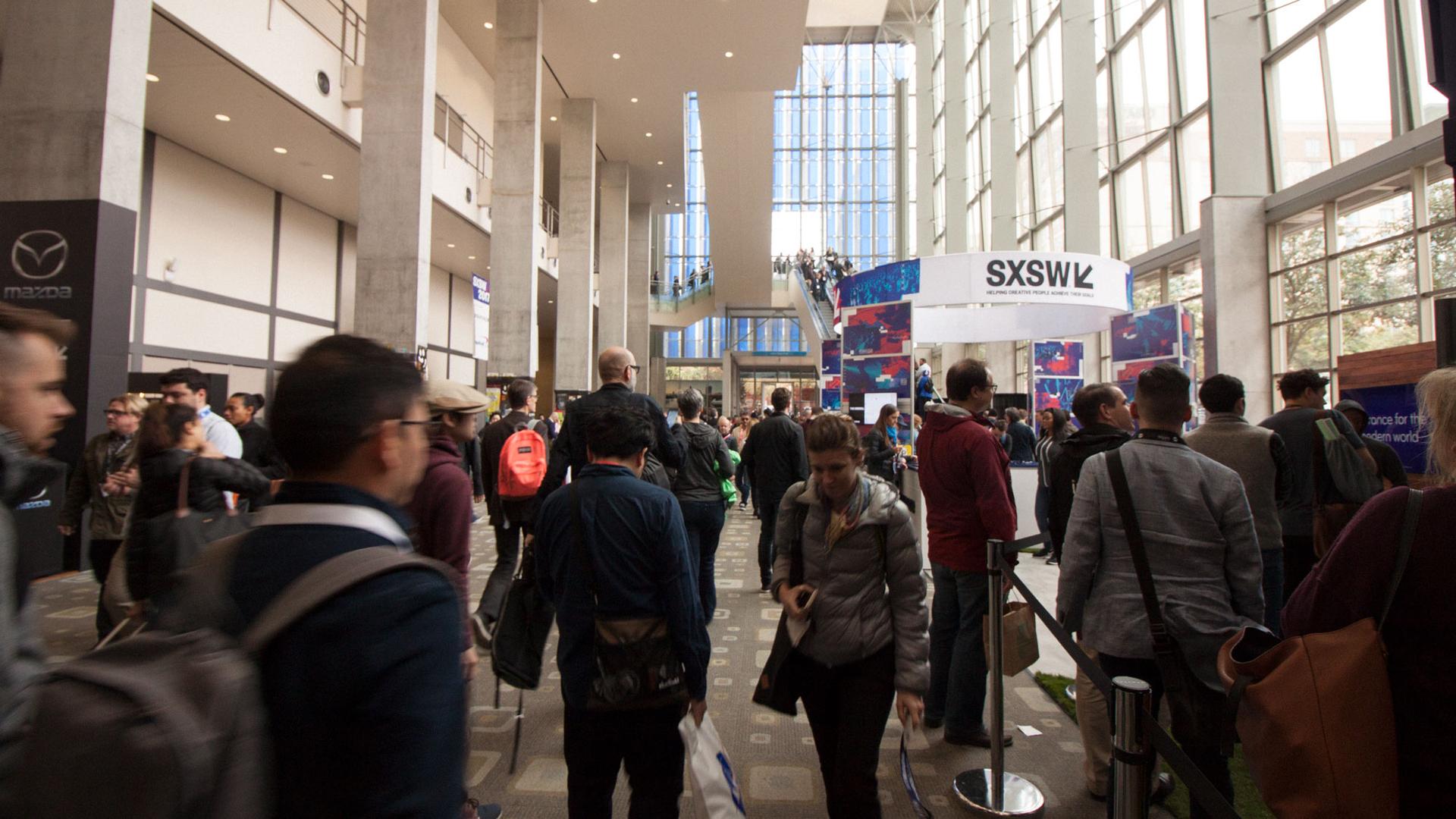 Attendees of SXSW Interactive pass through the halls inside the Austin Convention Center.