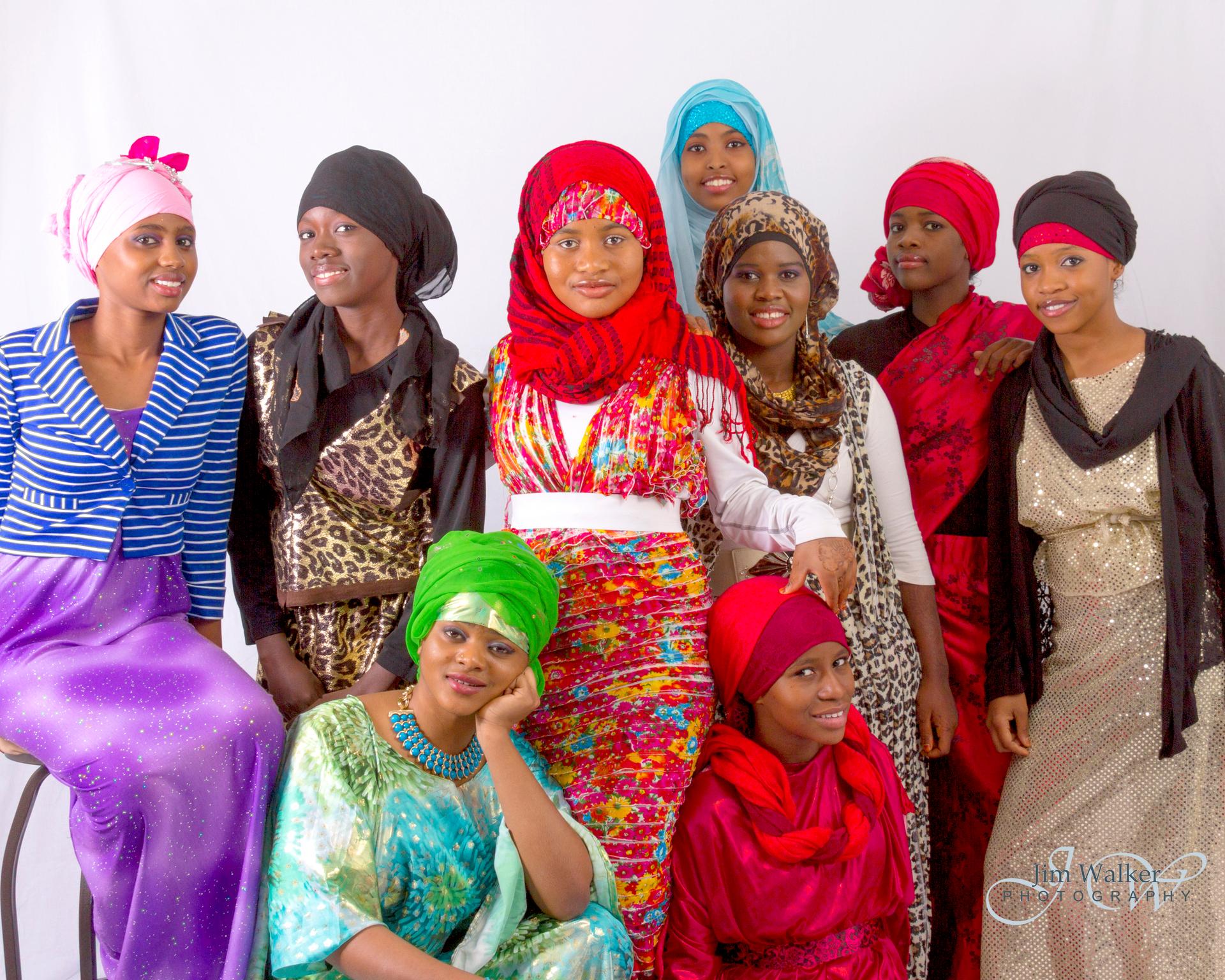 Sahro Hassan (center) surrounded by friends and family modeling her designs.