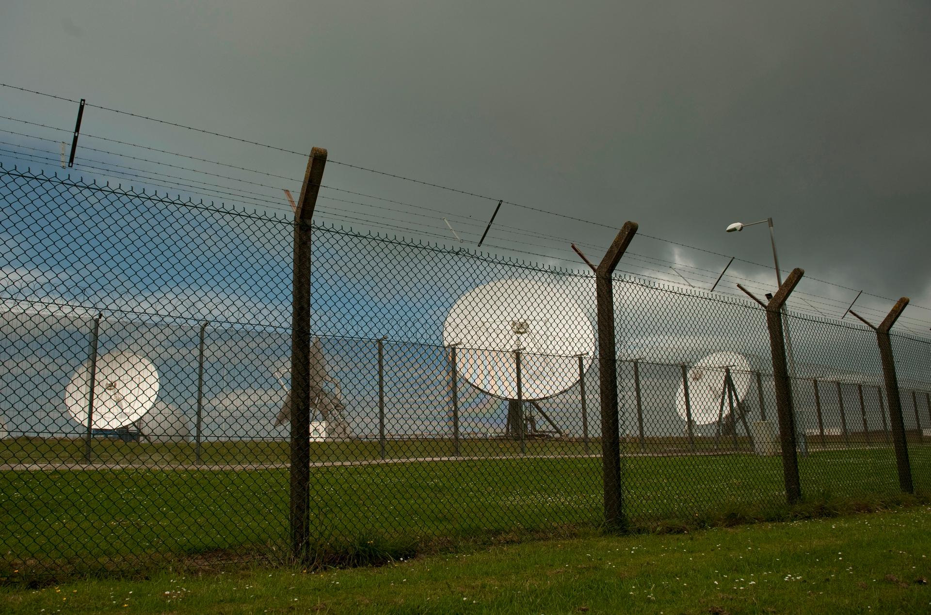 Satellite dishes at Britain's spy agency GCHQ, close to where trans-Atlantic fibre-optic cables come ashore in Cornwall. GCHQ has tapped fibre-optic cables that carry international phone and internet traffic and is sharing vast quantities of personal info