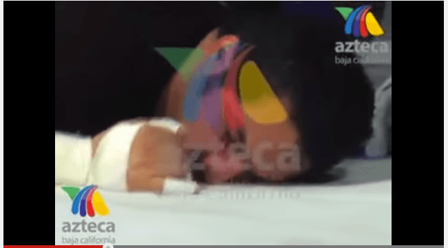 Luchador Perro Aguayo Jr. lays motionless on the mat during the match in which he died.