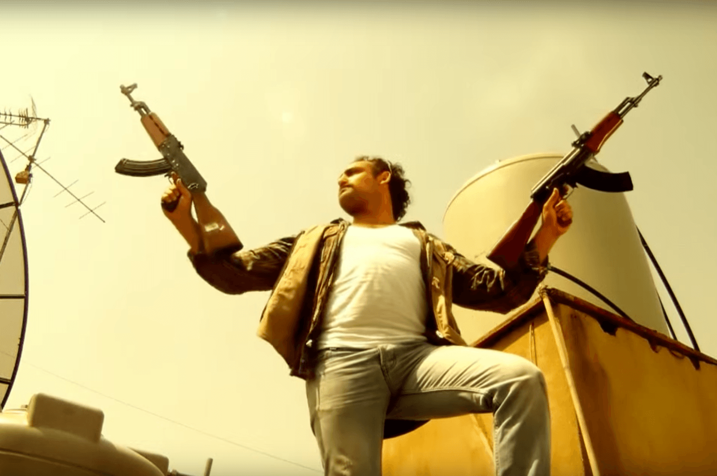 An actor fires guns from a rooftop in Beirut in a short satirical video made by Cheyef 7alak, a Lebanese advocacy group, to highlight the dangers of celebratory gunfire.