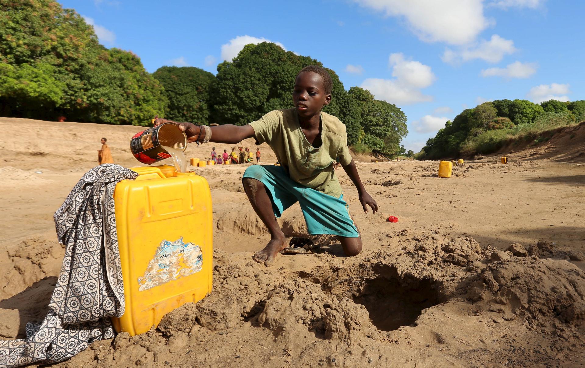 Somali boy gathering water