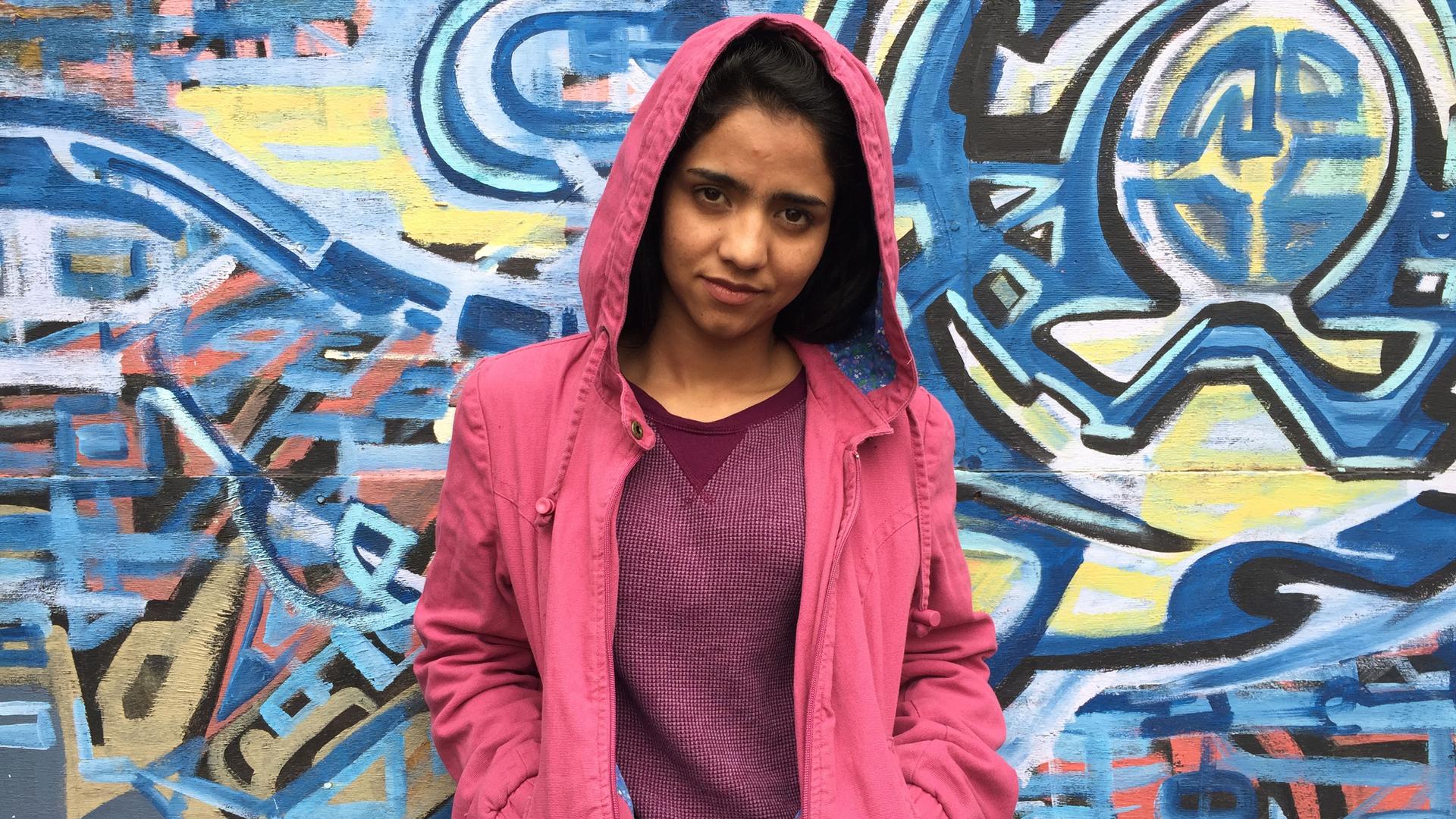 Afghan rapper Sonita Alizadeh narrowly escaped a forced marriage at 16 by writing the song 'Brides for Sale.' She recently visited West Oakland, CA, and was surprised that the U.S., like Iran and Afghanistan, has poor neighborhoods and homeless people.