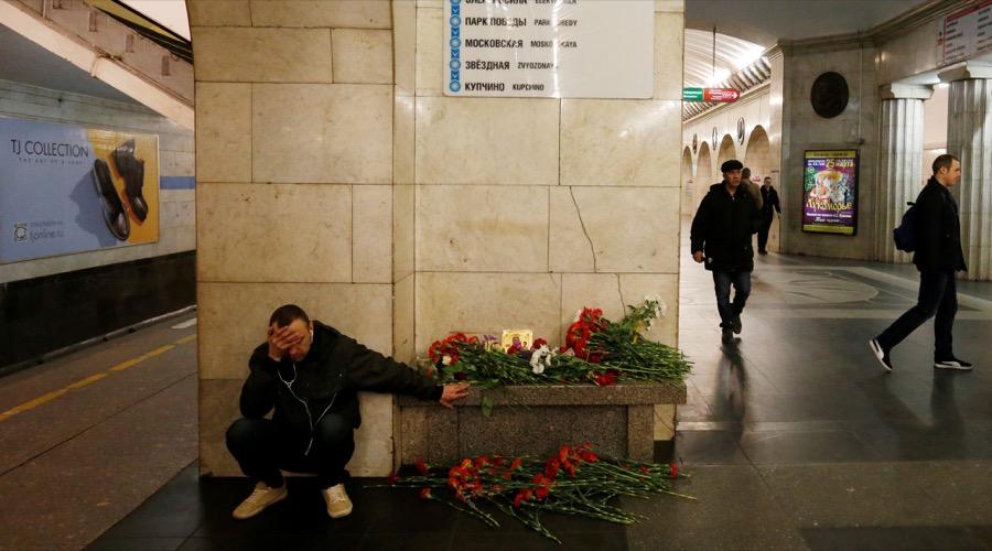 A man mourns next to a memorial site for the victims of a blast in the St. Petersburg subway on April 4.
