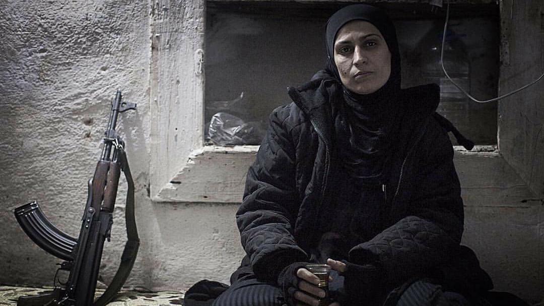 A part-time fighter with the anti-government forces in Aleppo, who gave her name simply as ‘Um Abdo’ - or ‘mother of Abdo,’ her eldest son