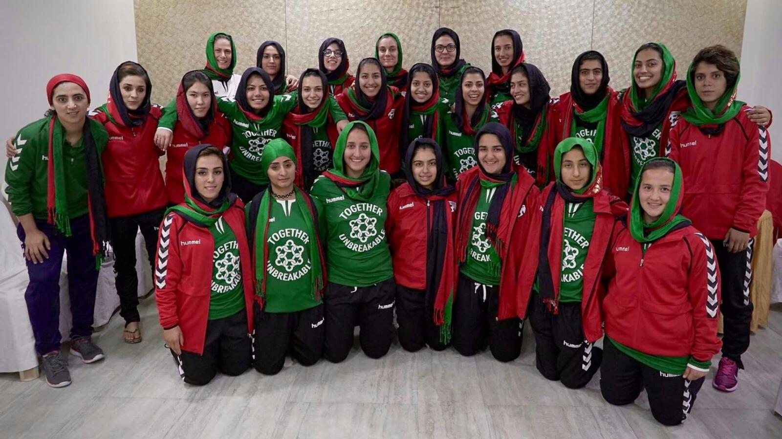 the Afghanistan Women's National soccer team poses in uniform