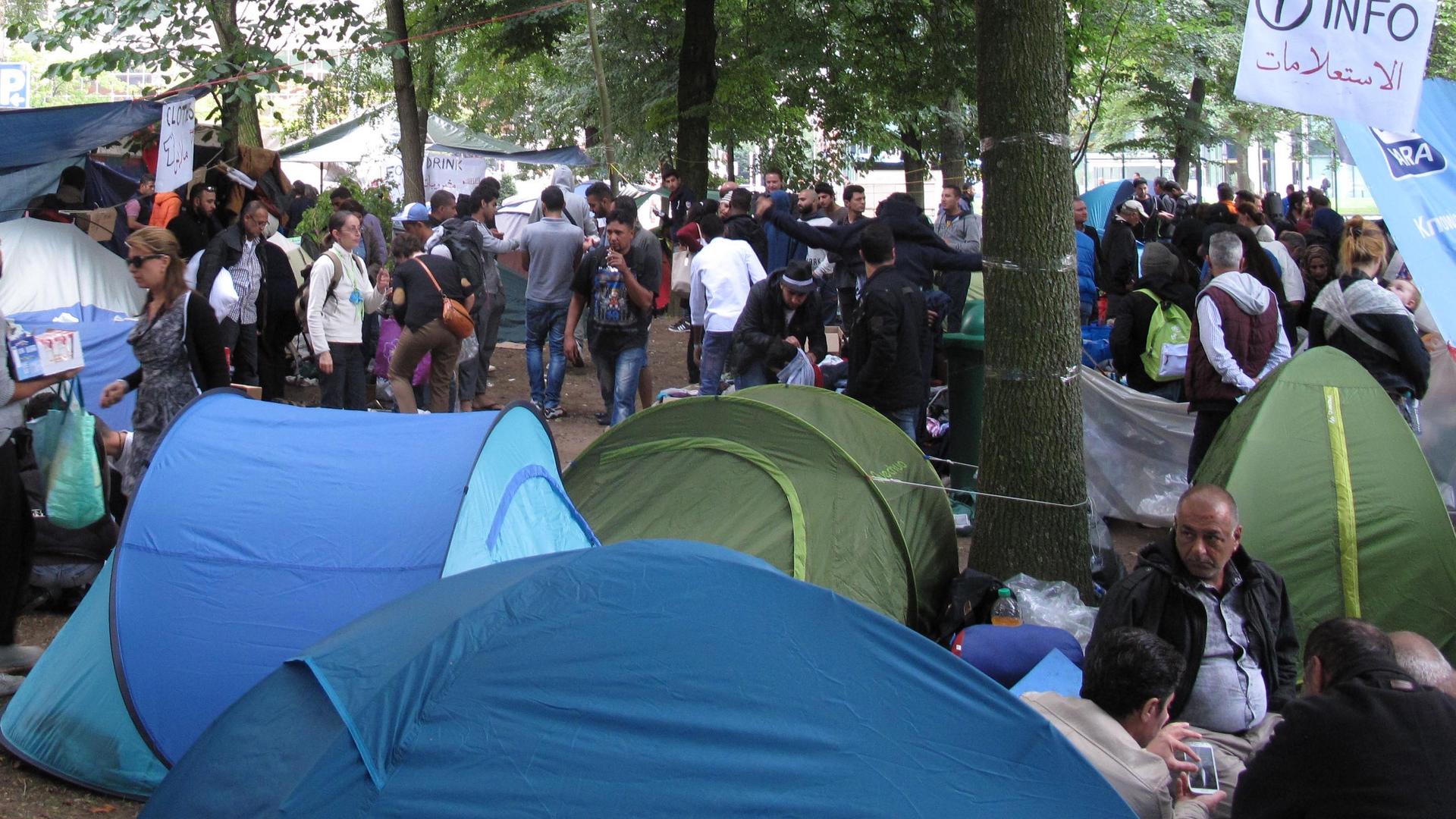 A public park in downtown Brussels houses a tent city with scores of families camping out in donated tents. Charity workers say they've never seen so many refugees occupy a public space at one time in Belgium. 
