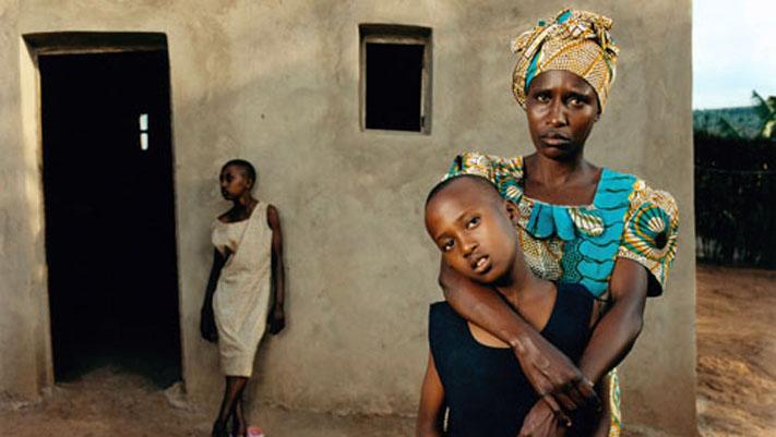 A genocide survivor and her children.