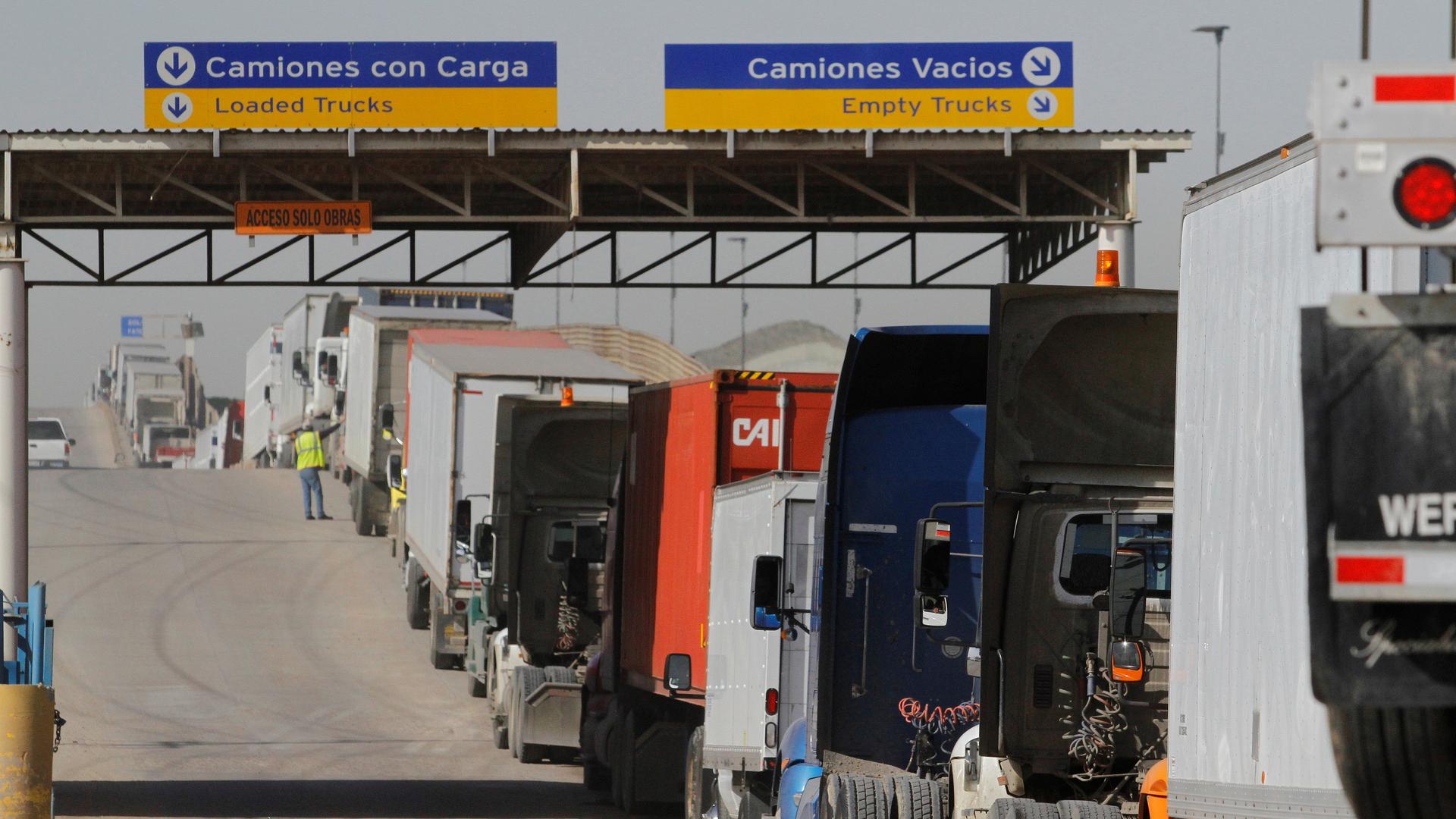 Trucks wait in a long queue for border customs control to cross into the U.S. at the Otay border crossing in Tijuana, Mexico, February 2, 2017.