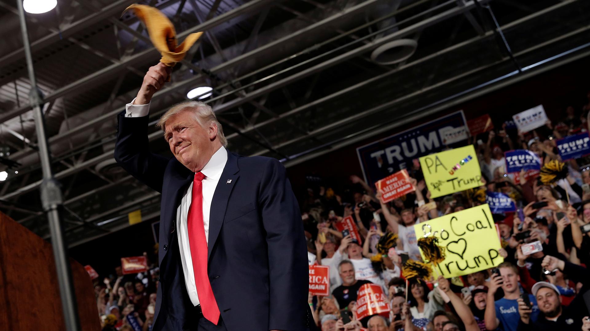 Republican U.S. presidential nominee Donald Trump arrives at a campaign rally in Ambridge, Pennsylvania, October 10, 2016. He waves "The Terrible Towel," the rally towel of the Pittsburgh Steelers. 