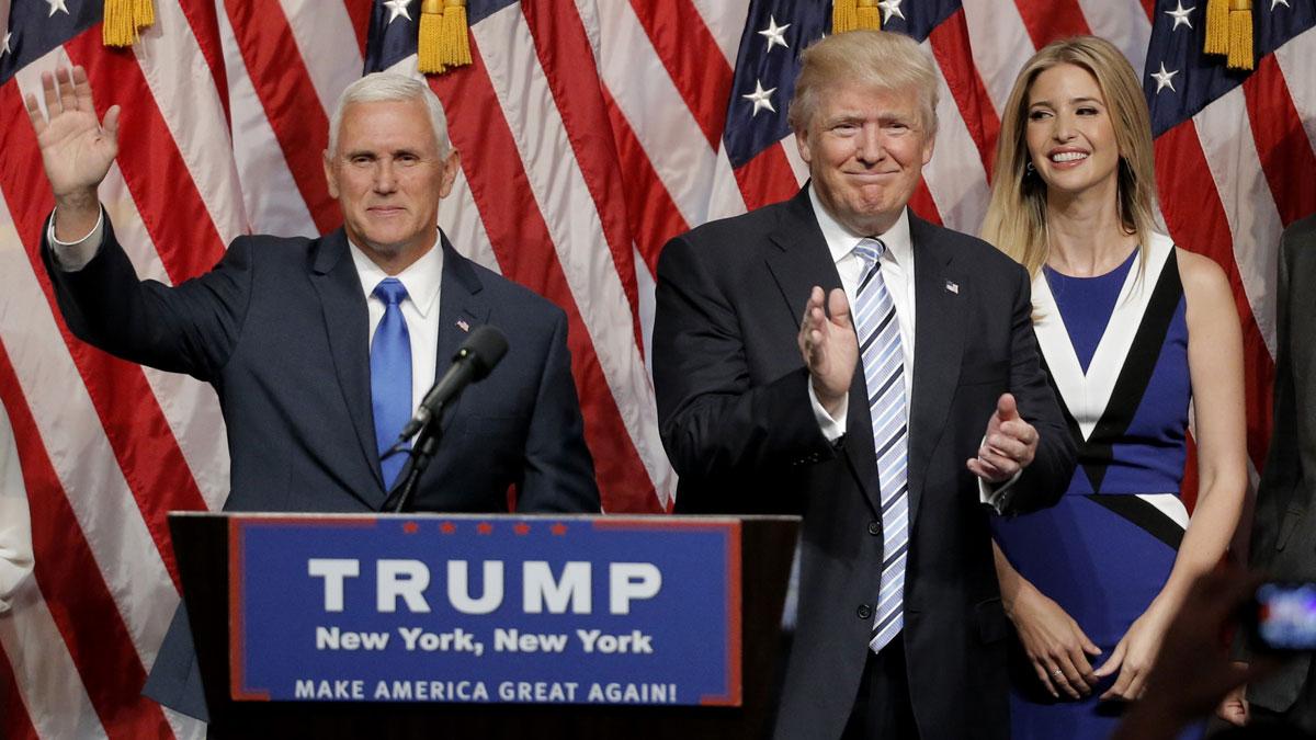 Republican presidential candidate Donald Trump applauds Saturday after introducing Indiana Governor Mike Pence as his vice presidential running mate.
