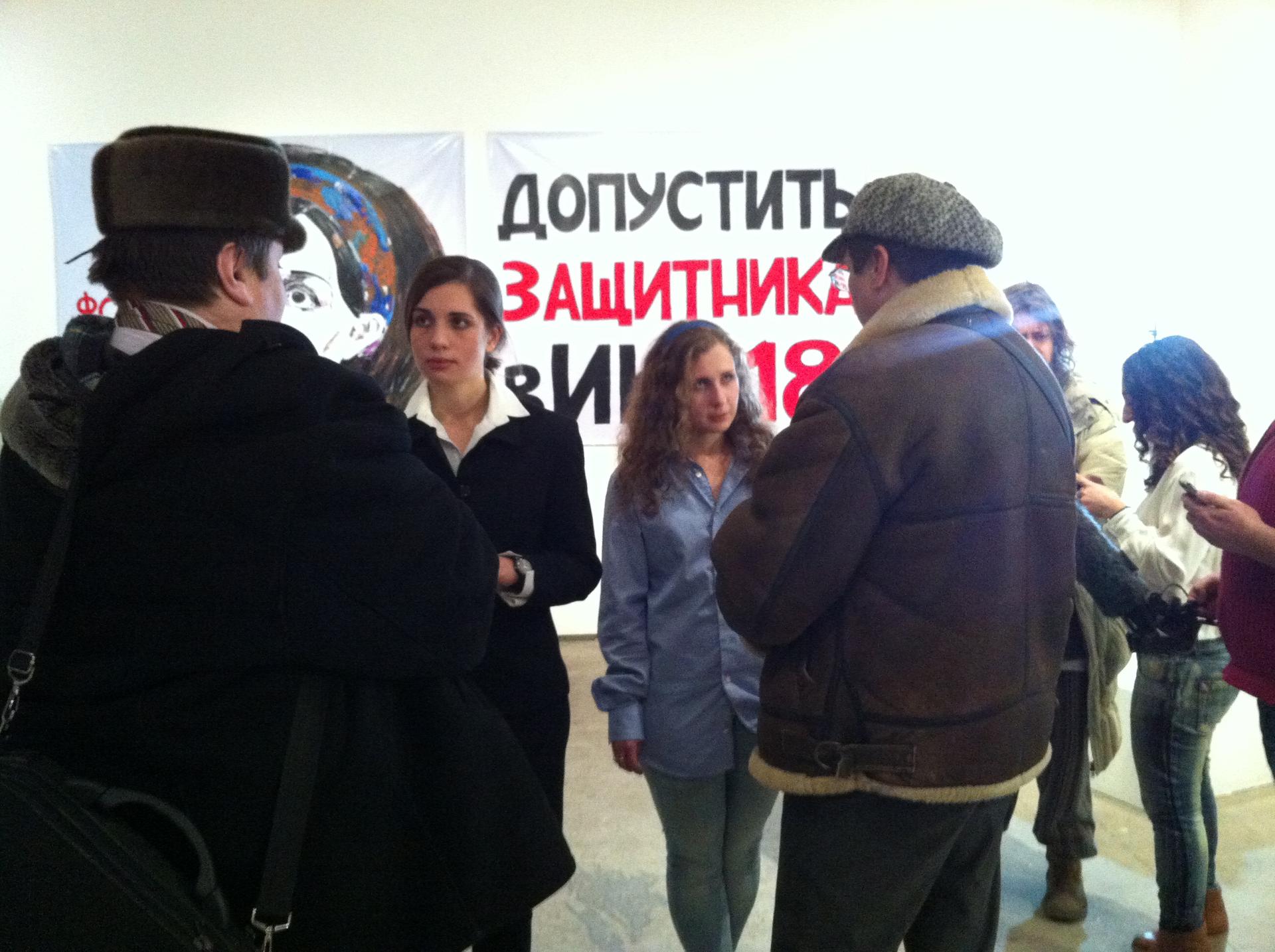 Pussy Riot's Nadezhda Tolokonnikova and Maria Aliokhina speak with two supporters at the Vinzavod Center for Contemporary Art in Moscow. Many wanted to speak with them about prison conditions in Russia.