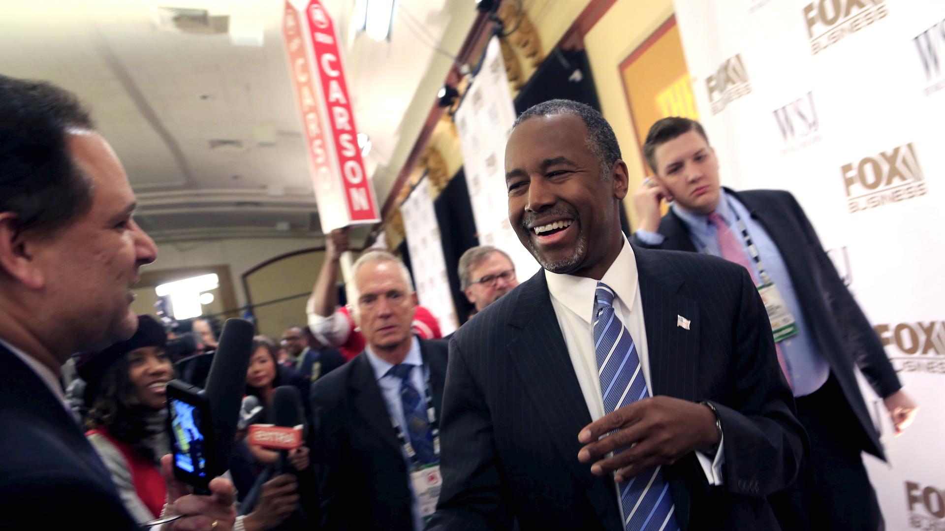 Ben Carson takes questions from the media in the spin room after the debate held by Fox Business Network for the top 2016 U.S. Republican candidates in Milwaukee, Wisconsin on November 10, 2015.
