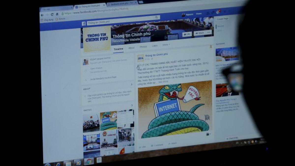 An internet user browses through the Vietnamese government's Facebook page in Hanoi.