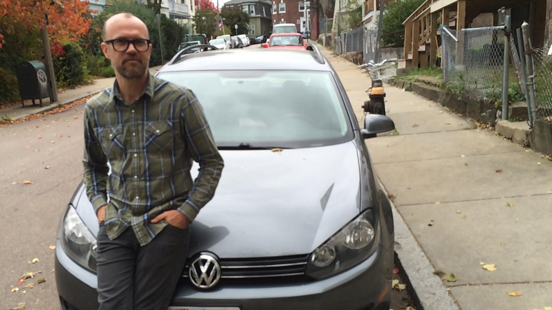 P.J. Goodwin, in Boston, in front of his 2010 diesel Volkswagen Jetta SportWagen, a car sold to him as "clean diesel."