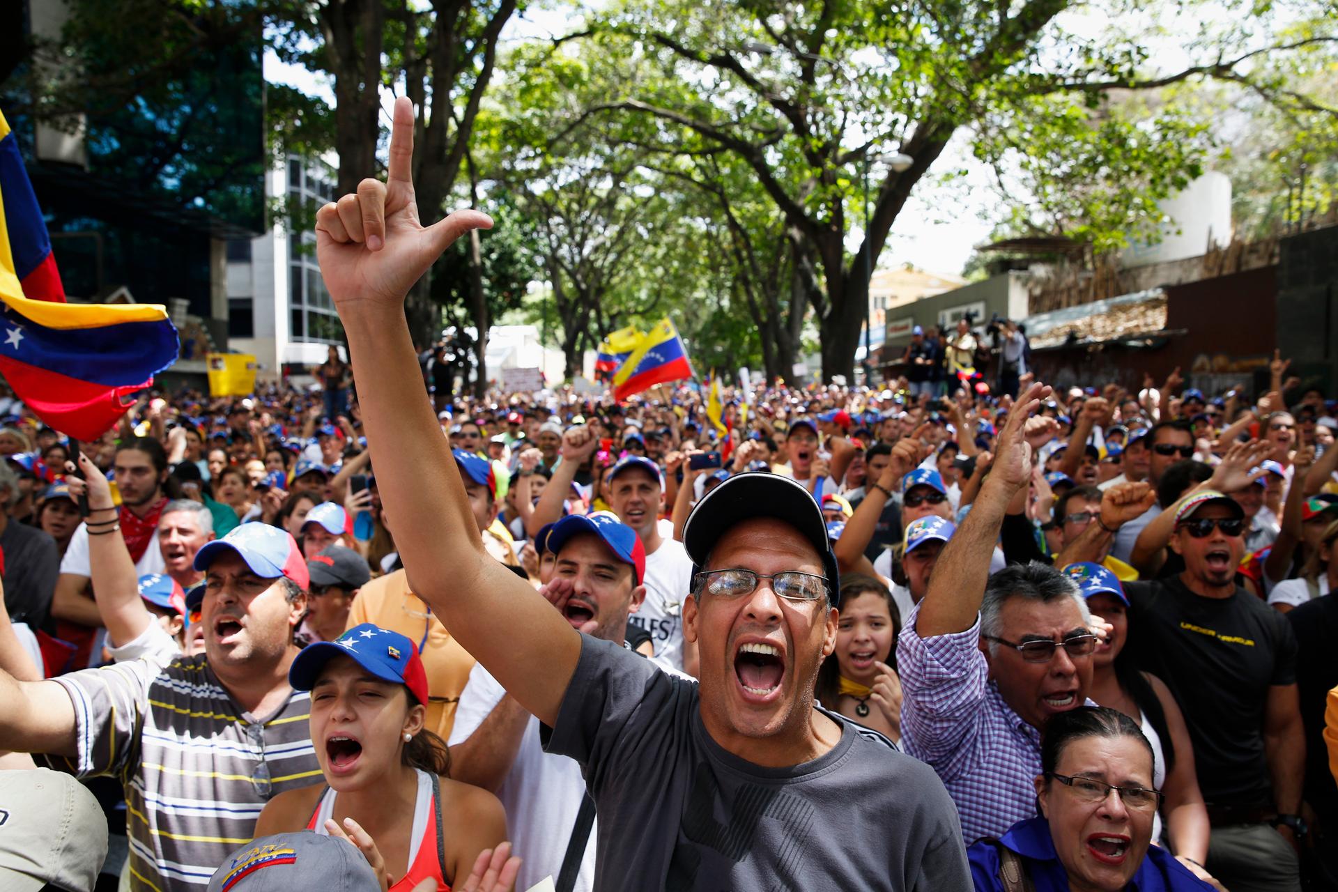 Anti-government protesters shout during a protest against Nicolas Maduro's government in Caracas March 3, 2014. 