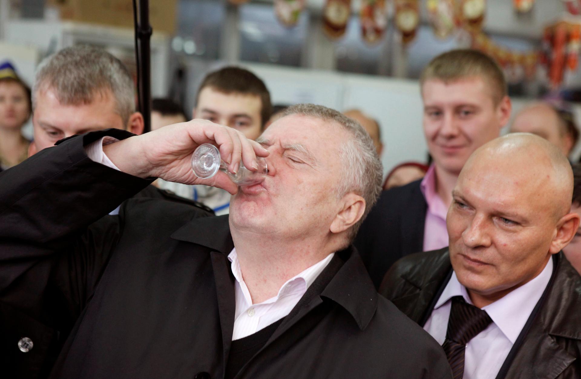 Vladimir Zhirinovsky, leader of the Liberal Democratic Party of Russia, drinks a shot of vodka while visiting a market as part of his party Duma election campaign in the southern Russian city of Stavropol.
