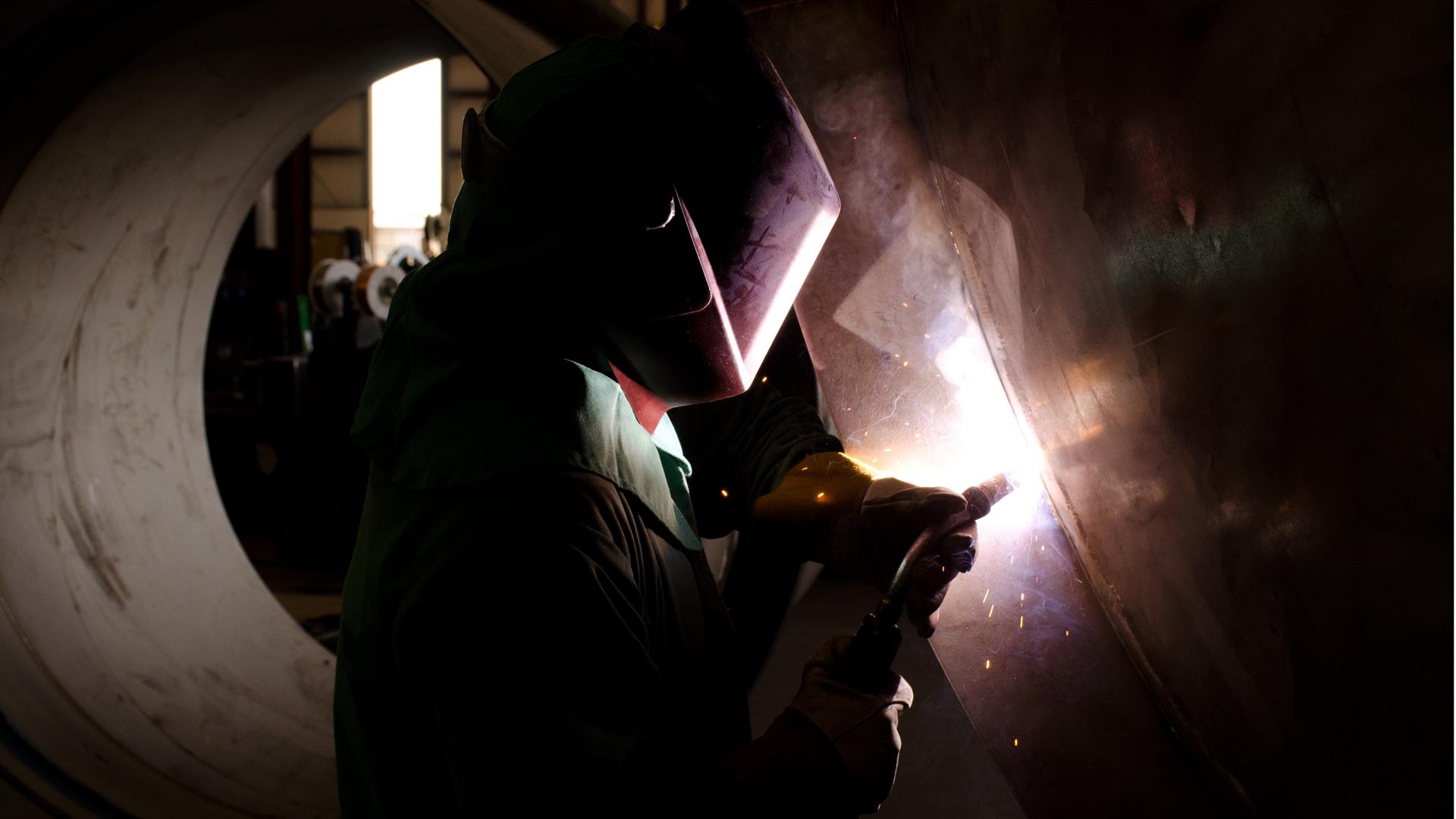 A welder at Caid Industries. Business has slowed this year at the Tucson, AZ company with uncertainty surrounding the future of NAFTA. 