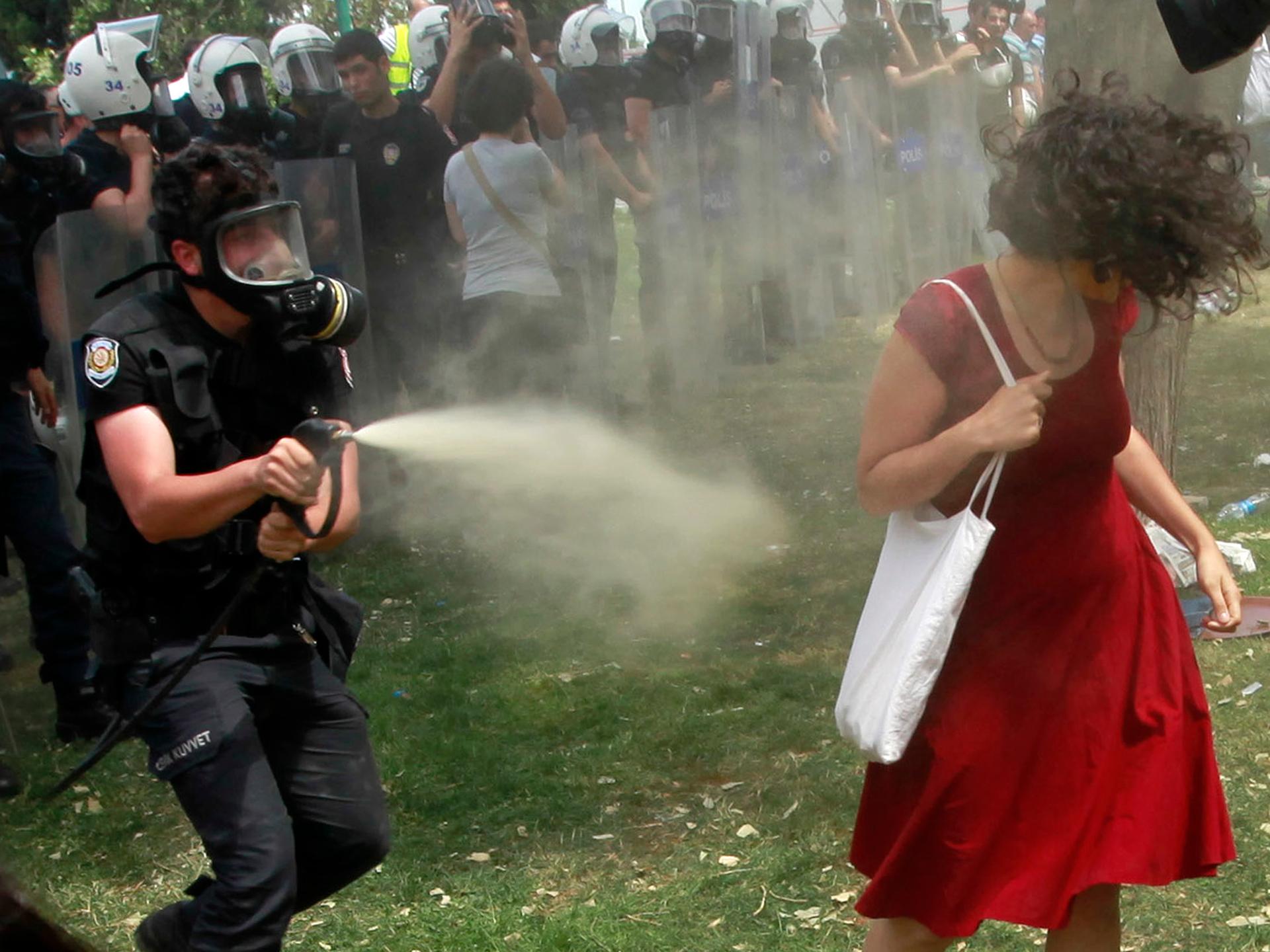 A now-iconic picture of a Turkish riot policeman using tear gas against "the woman in red," at an anti-government demonstration in Taksim Square, in the heart of Istanbul.