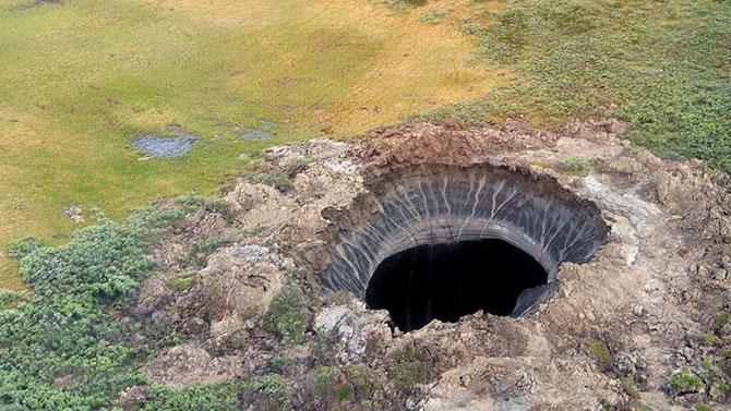 This gaping hole in the Siberian tundra was the first of two recently discovered on Russia's far northern Yamal Peninsula. Scientists say they almost certainly appeared on the landscape only recently, and may be a result of a buildup of gas underground, l