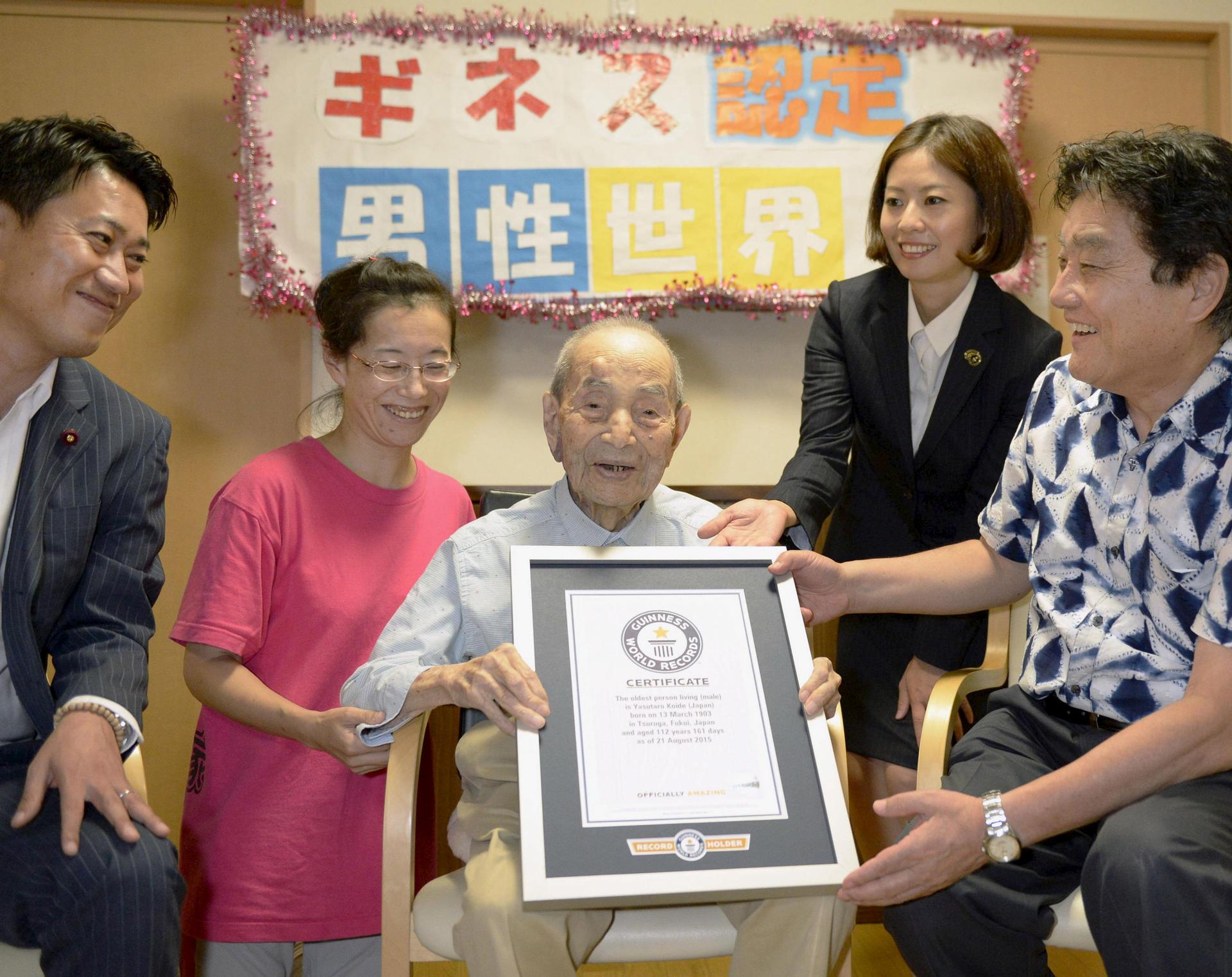 Japanese Yasutaro Koide, 112, receives the Guinness World Records certificate as he is formally recognized as the world's oldest man. He lives in a nursing home in Nagoya, in central Japan.
