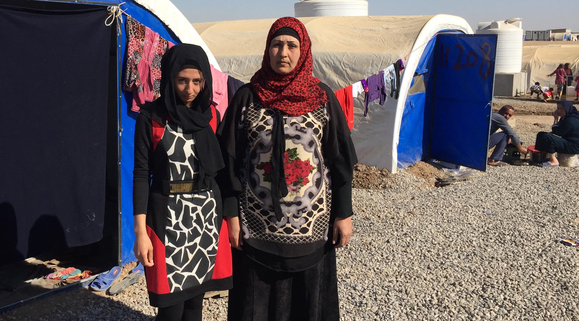 Zikra Younis, right, and her daughter Huda at the Khazer camp for displaced people. The camp is east of the Iraqi city of Mosul, where they escaped from last November.