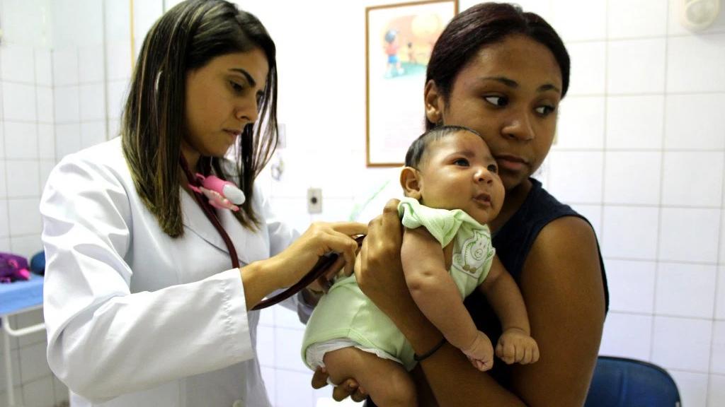 Dr. Natalia Brin examines a 2-month-old with suspected microcephaly in Brazil.