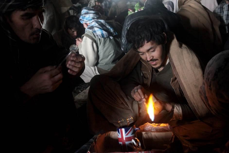 Three addicts preparing to smoke heroin under a bridge in Kabul’s Pol-e Sokhta neighborhood.