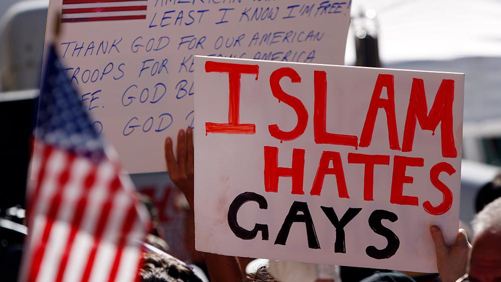 People display signs at a demonstration against the proposed Islamic cultural center and mosque on the ninth anniversary remembrance of the attacks on New York and Washington, in New York, September 11, 2010.