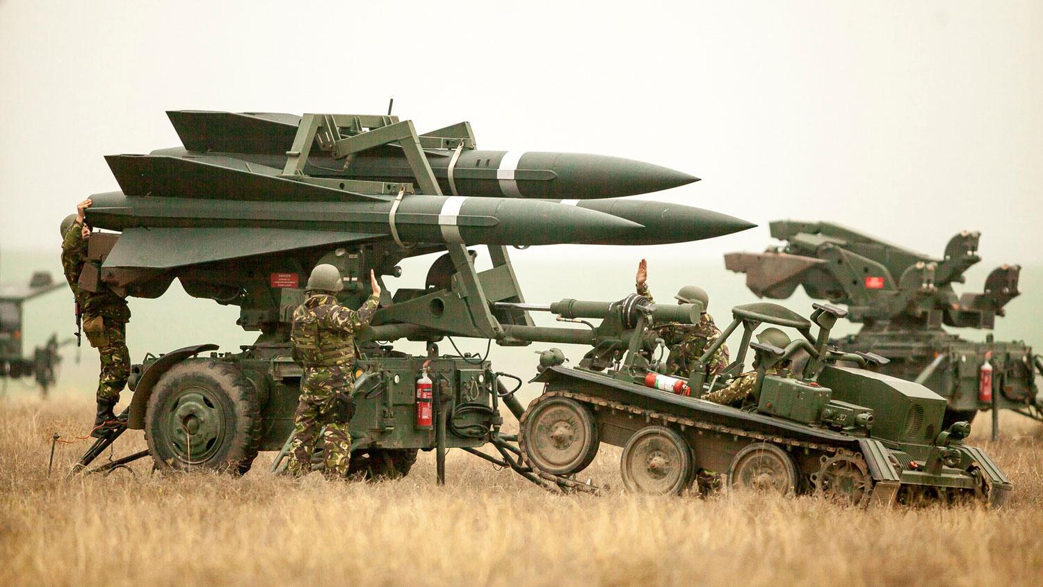 Romanian Army soldiers deploy a ground-to-air missile launch pad during a joint military exercise with the US Army.